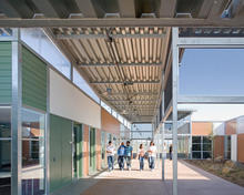 Floating canopies for all circulation and common spaces, as shown in the photo, contrast in character and form with the prefab components of the facility. - Photo Credit: Jim Brady Architectural Photography