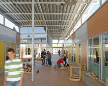 Exterior spaces adjacent to classrooms are used as workshop spaces in the project-based learning environment shown in the photo. - Photo Credit: Jim Brady Architectural Photography