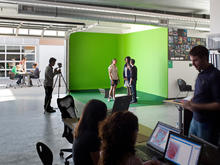 Seminar rooms are complemented by "Exploratories" like the one in this photo, which are suited to specific disciplines. These vary from engineering to environmental science rooms and have large roll-up doors to allow for outdoors work space. - Photo Credit: Jim Brady Architectural Photography